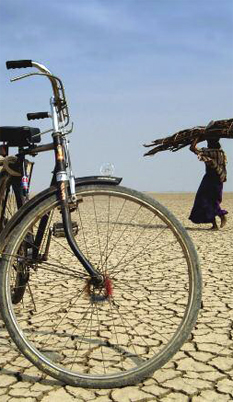 Drought Conditions, bycicle and woman walking